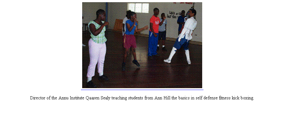 Text Box: ￼Director of the Annu Institute Qaasen Sealy teaching students from Ann Hill the basics in self defense fitness kick boxing. 